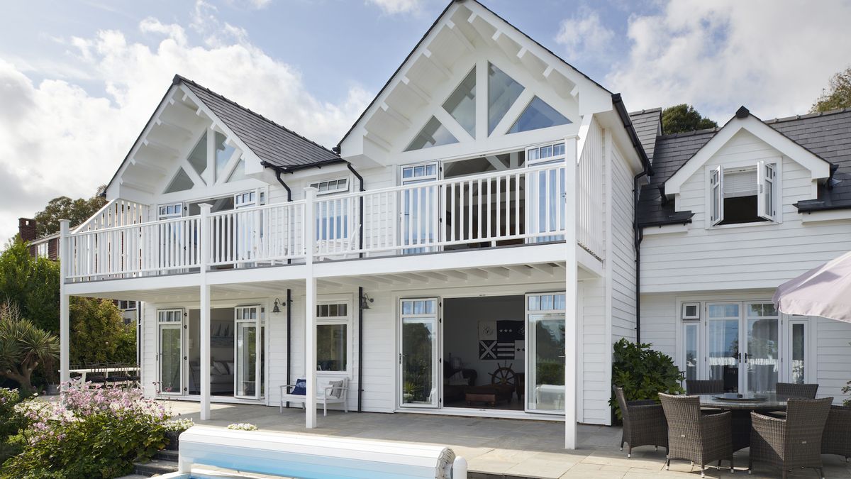 first floor extension to dated bungalow with white cladding