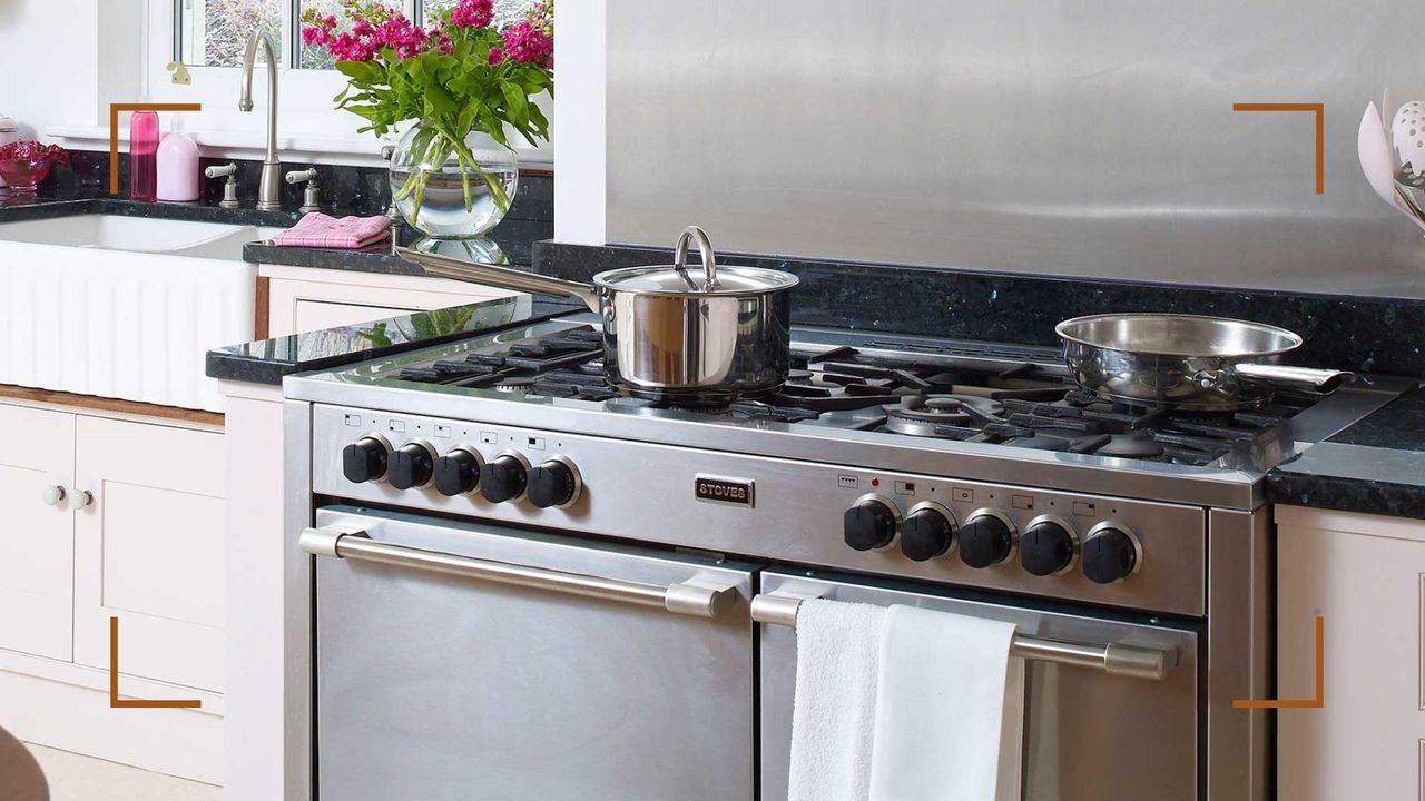 kitchen with stainless steel cooker with stainless steel pans to support a guide on how to remove rust from stainless steel