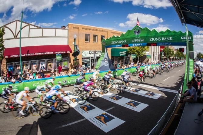 Riders pass by for the start of today's stage