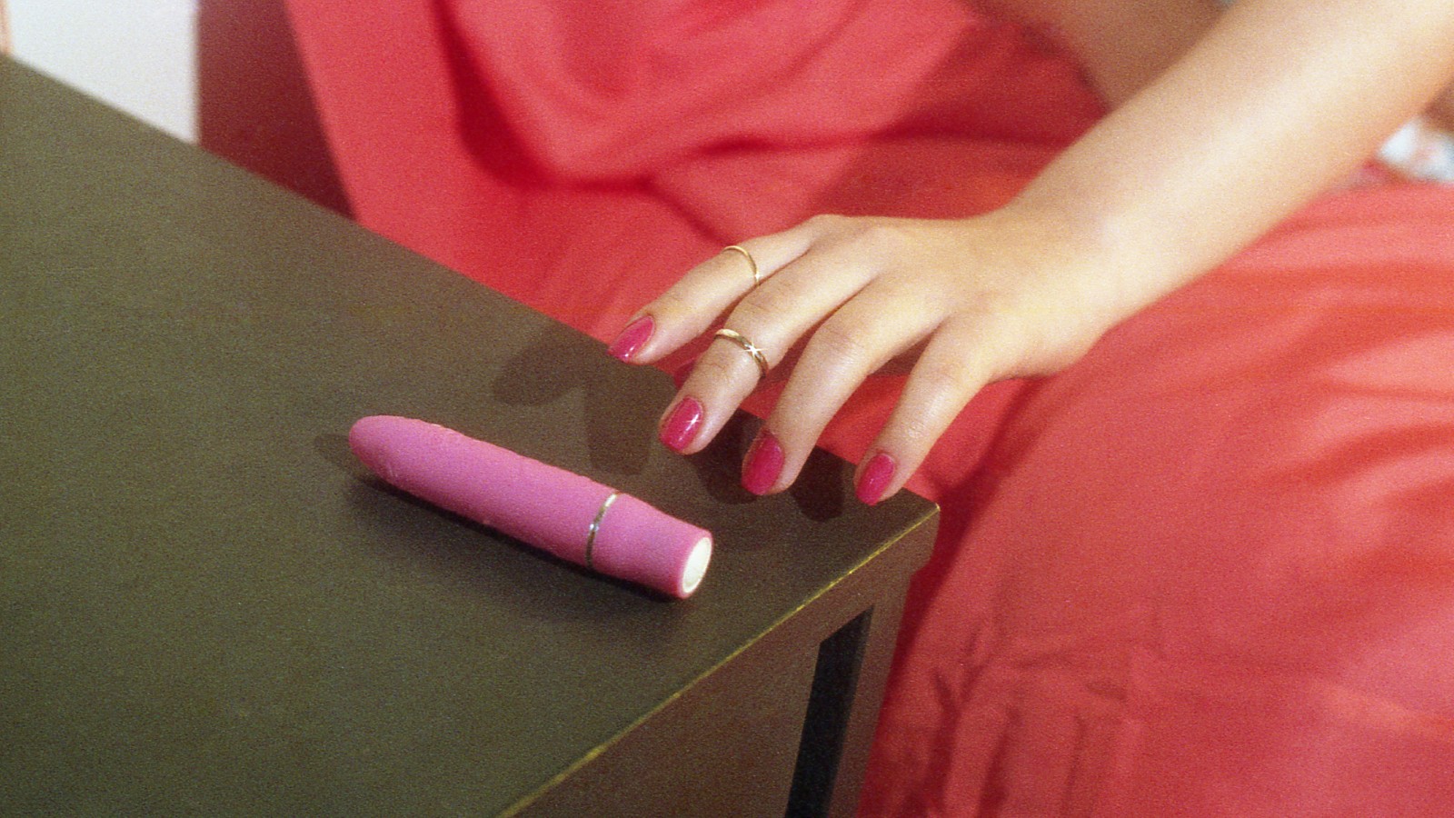 Woman reaching for sex toys