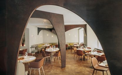 View of the dining space at Nomicos, Paris, France