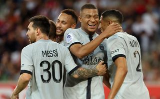 Achraf Hakimi of PSG (right) celebrates his goal with Kylian Mbappe, Neymar Jr, Lionel Messi during the Ligue 1 Uber Eats match between Lille OSC (LOSC) and Paris Saint-Germain (PSG) at Stade Pierre-Mauroy on August 21, 2022 in Villeneuve d'Ascq near Lille, France.