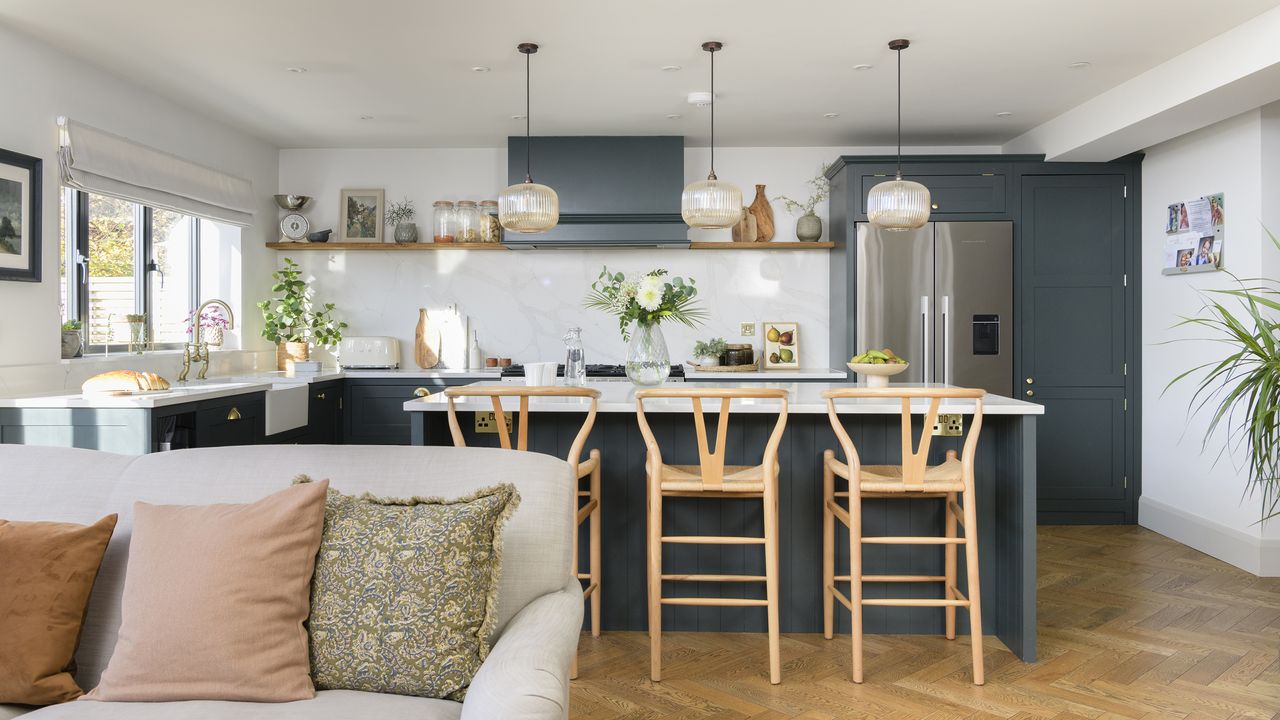 Navy kitchen with island and sofa 