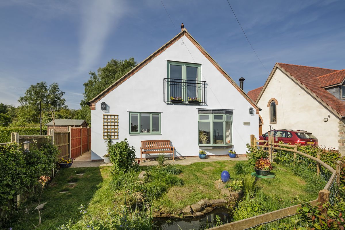 rendered exterior of self build home on a budget