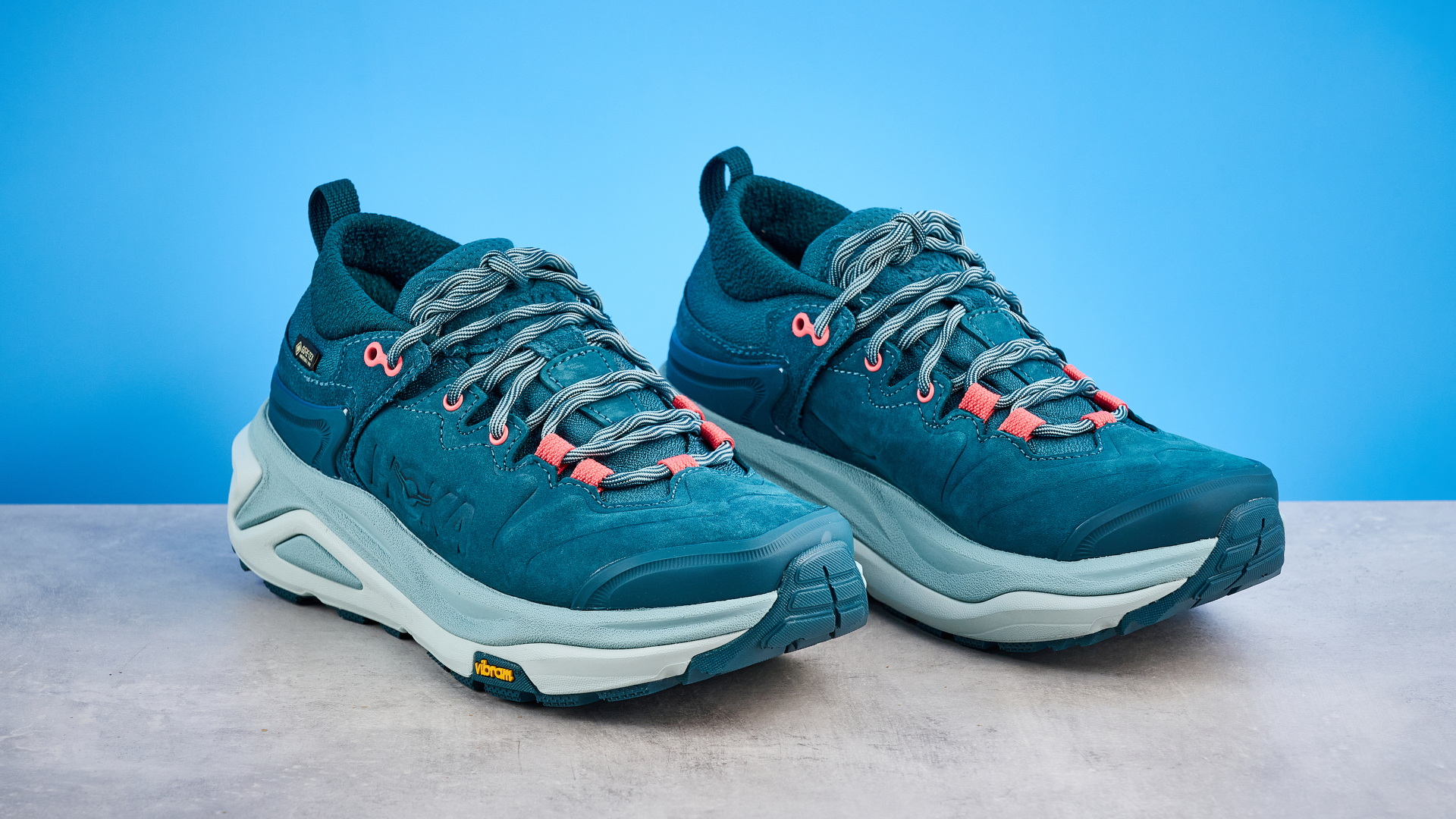 Hoka Kaha 3 Low GTX in droplet colorway photographed in front of a blue background