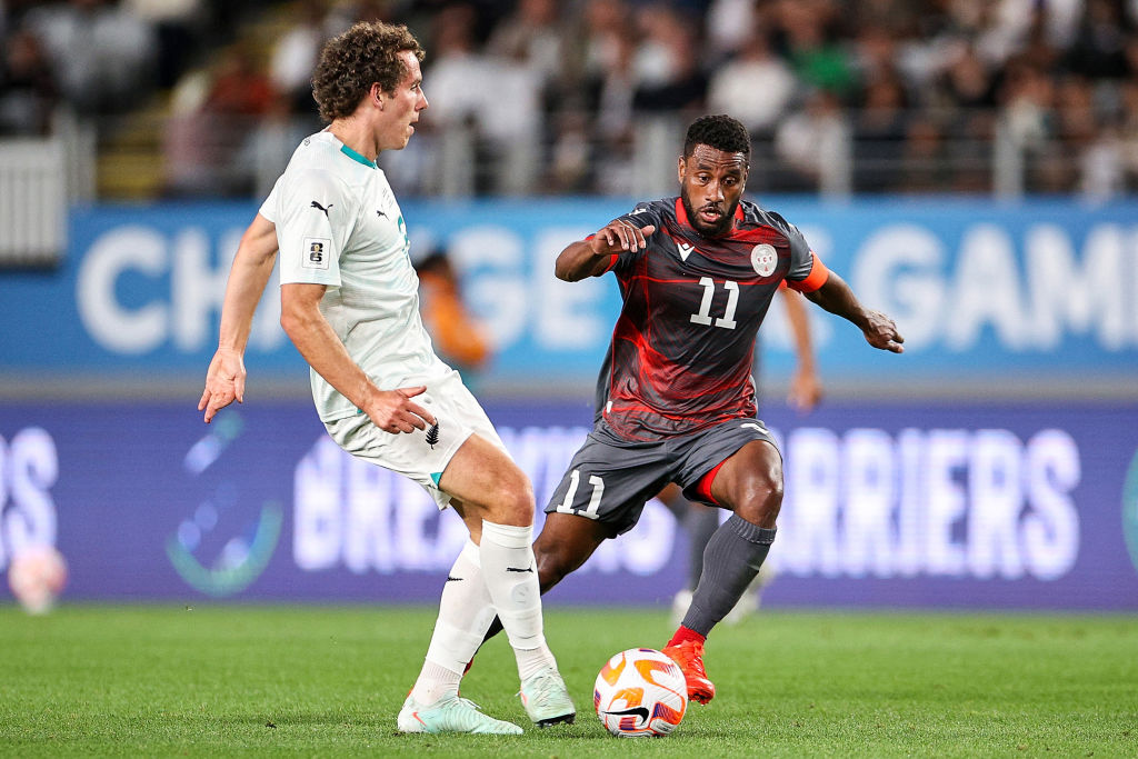 New Caledonia&amp;rsquo;s Cesar Zeoula (R) challenges New Zealand&amp;rsquo;s Joe Bell during the FIFA World Cup 2026 Oceania qualifiers group final football match between New Zealand and New Caledonia at Eden Park Stadium in Auckland on March 24, 2025. (Photo by DAVID ROWLAND / AFP)