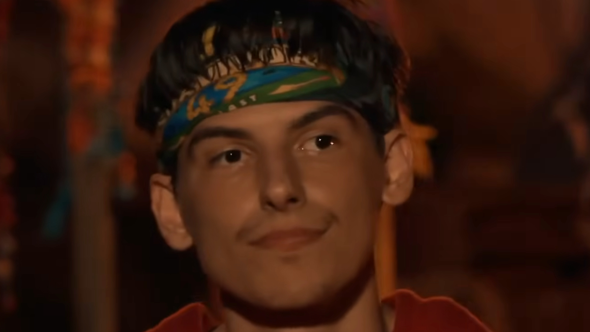 Rizo wears a headband during Tribal Council on Survivor 49.