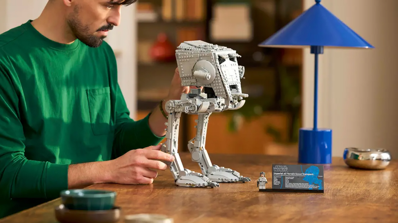 Lego AT-ST set being built by man in his home