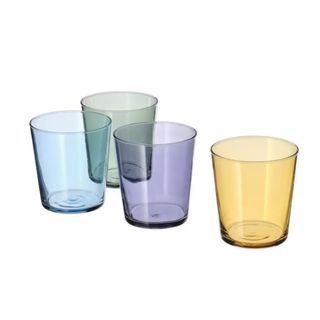 Four glasses - one blue, one green, one purple, and one yellow