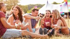 People eat food together at a festival