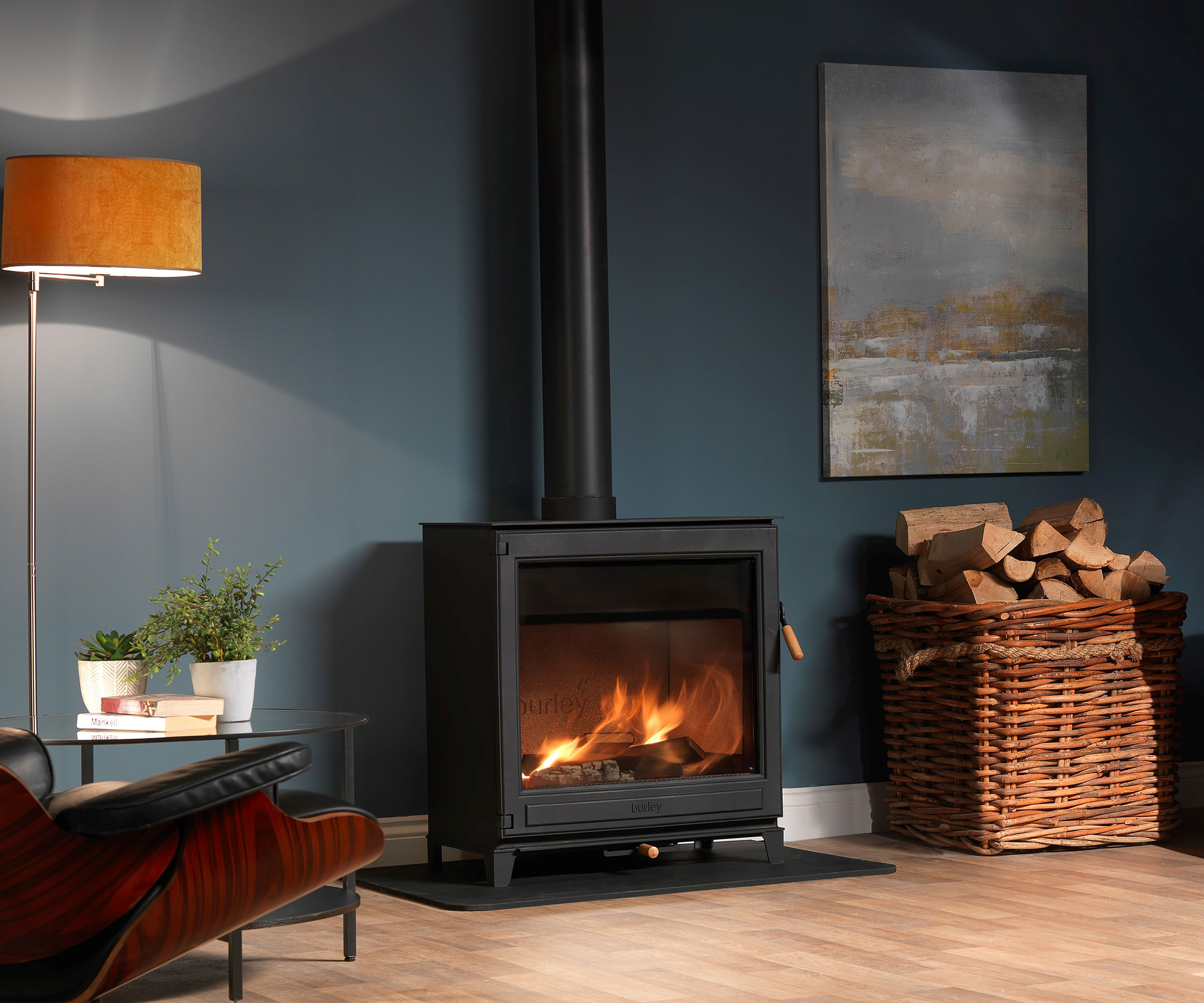 modern log burning stove in blue living room