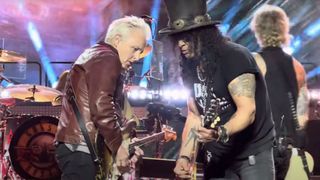 Mike McCready of Pearl Jam and Slash perform Paradise City onstage with Guns N' Roses in Seattle