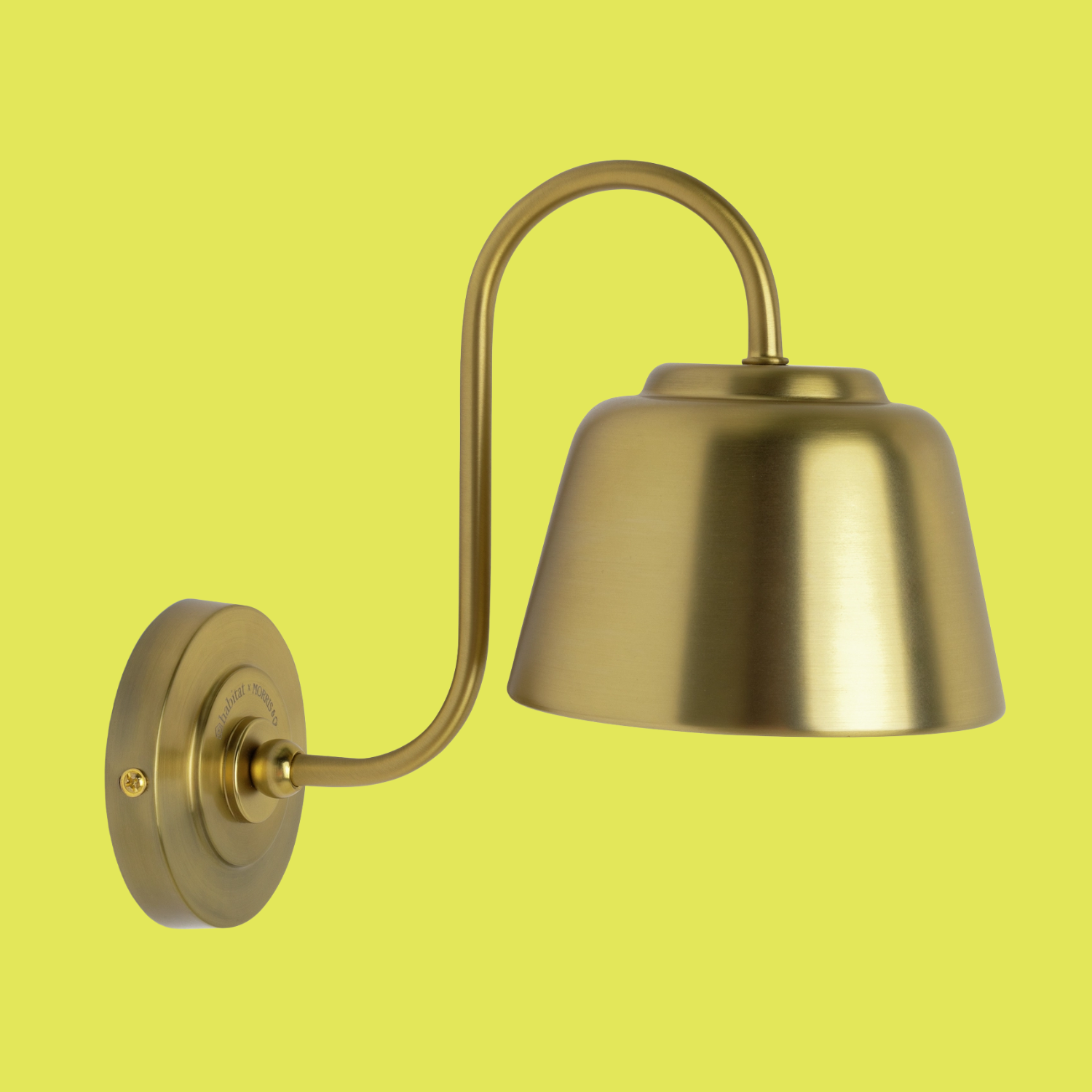 A wall sconce with a gold finish