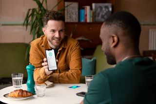 Two men with a Zopa Visa card at lunch