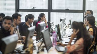 Office workers in India at their desks