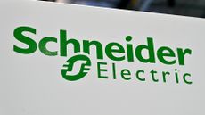 The company logo for Schneider Electric displayed in green on a white sign.