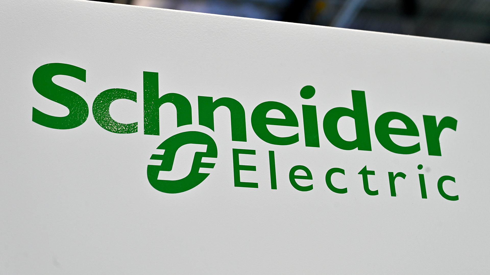 The company logo for Schneider Electric displayed in green on a white sign.