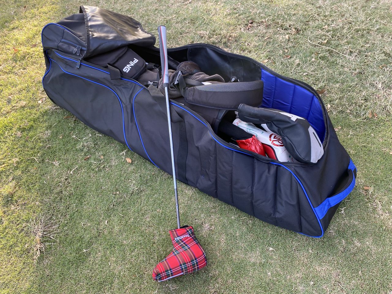The BagBoy T-660 Travel Cover lies on the floor