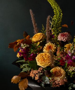 Ronny Colbie autumnal bouquet with yellow roses and golden leaves