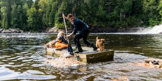 Daisy Ridley and Tom Holland on a river raft as Viola and Todd in Chaos Walking