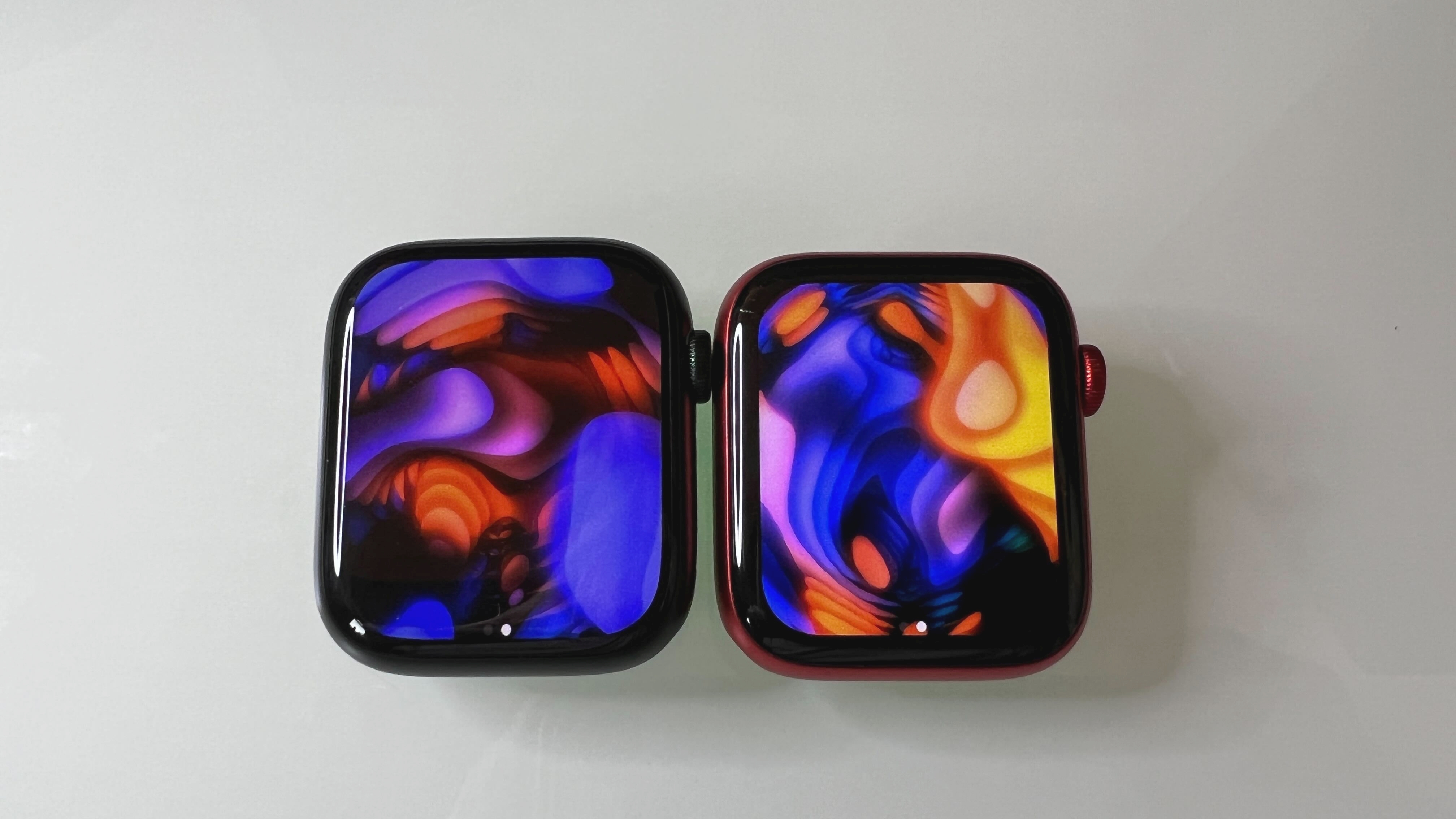 An Apple Watch 7 (45mm) on the left and an Apple Watch 6 (44mm) on the right