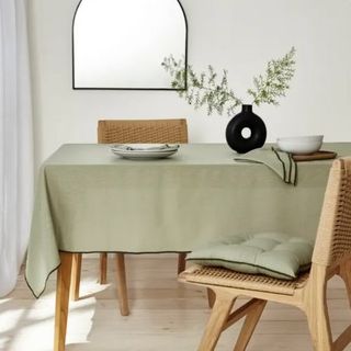 dining area with green table cloth 