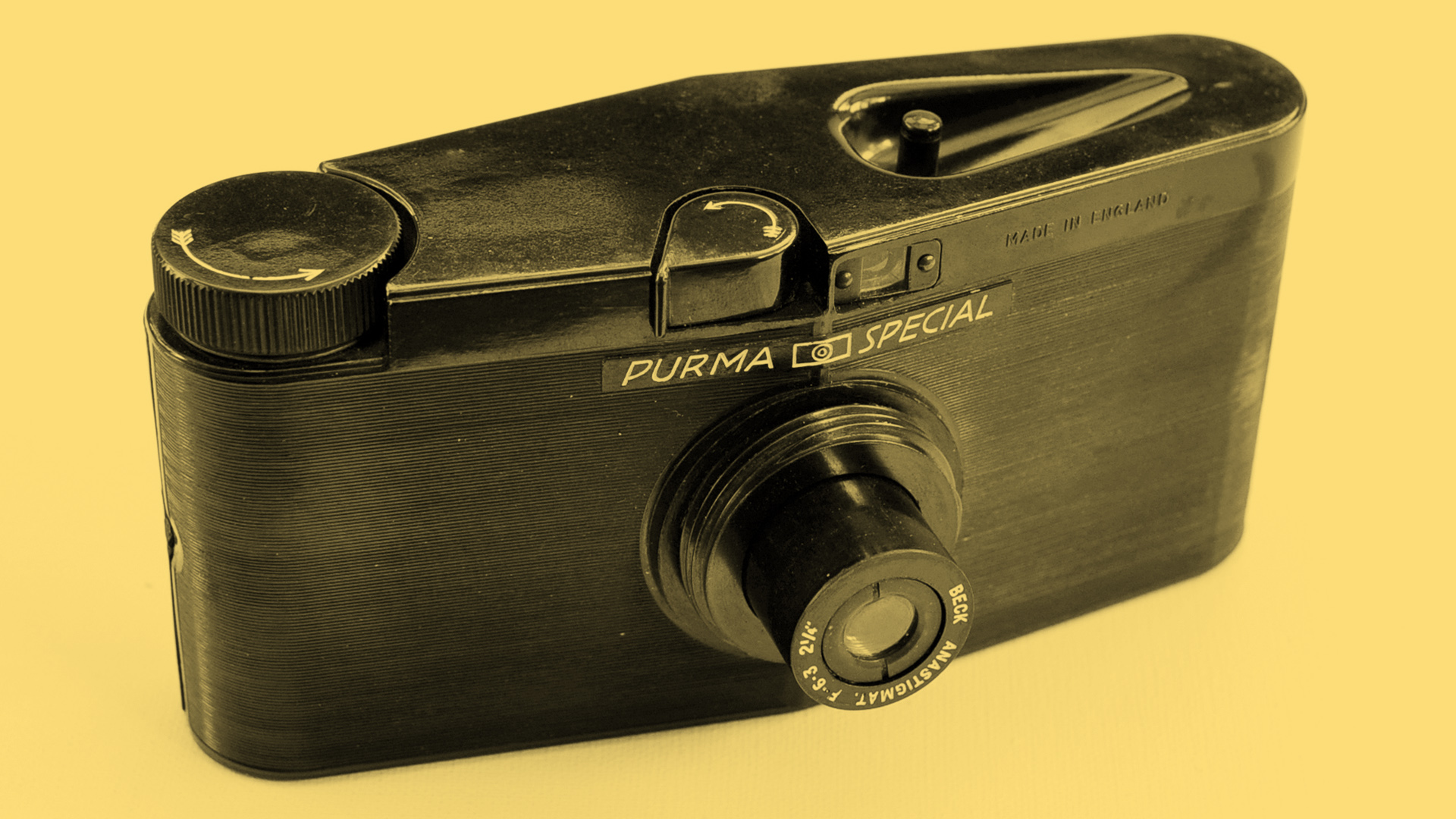 The front of the Purma Special camera on a yellow background