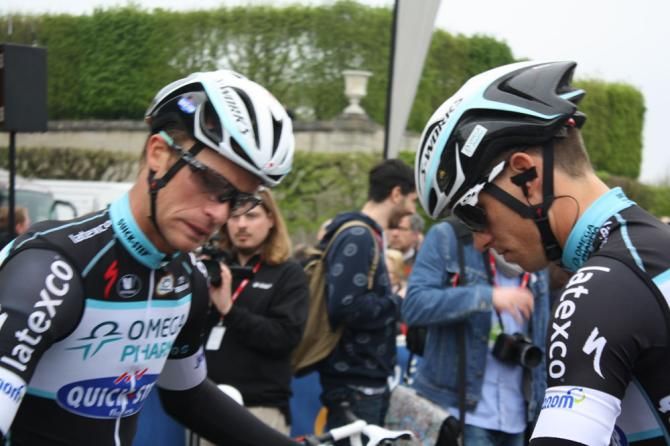 Iljo Keisse gets a bit nervous as he tries to prop his bike against Zdenek Stybar's