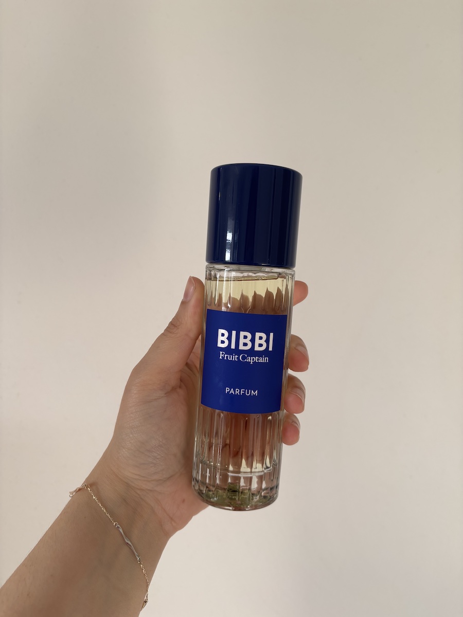 Mica Ricketts holding Bibbi Fruit Captain Eau de Parfum