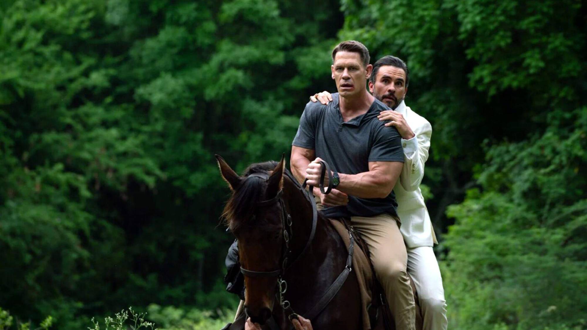 (L-R) John Cena as Mason Pettits and Juan Pablo Raba as Juan Venegas in "Freelance"