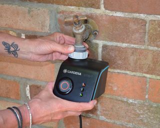Attaching an automated smartphone watering timer to an exterior garden tap