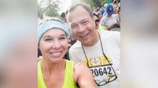 Woman and man in a crowd take selfie of themselves smiling