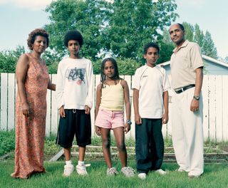 A family standing in a garden