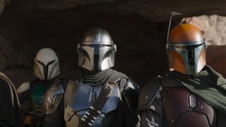 Din Djarin side-by-side with other Mandalorians in The Mandalorian season 3