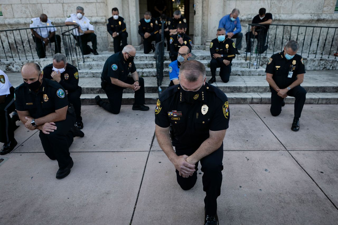 Kneeling police officers.