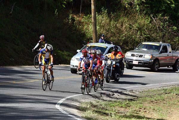 A rider assesses his competition as he swings off.