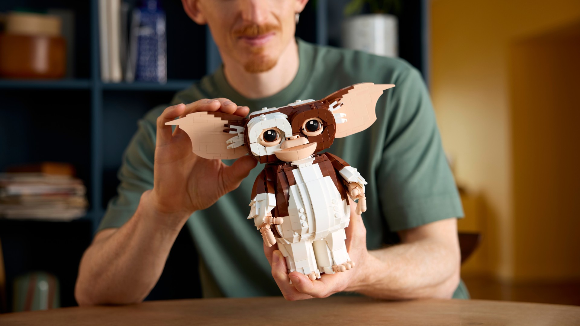 Lego Gizmo set being held by builder