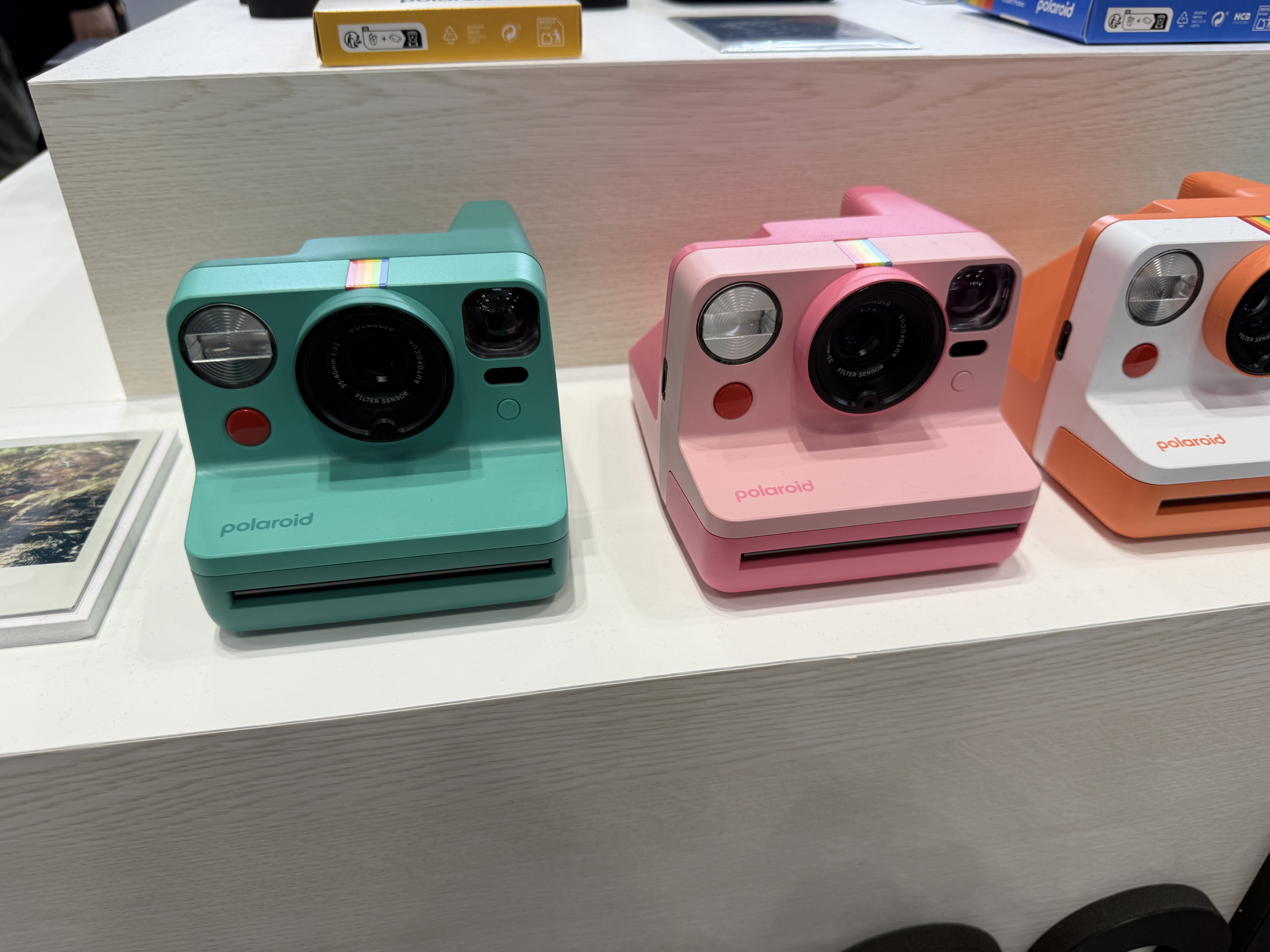 Polaroid Now Gen 3 instant camera in three colorways, side by side on display at CP+ 2026