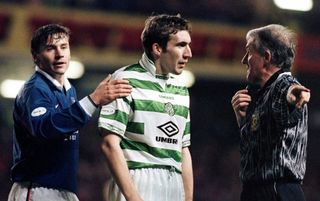 Andrei Kanchelskis taps Alan Stubbs (centre), who argues with referee Jim McCluskey during Rangers vs Celtic