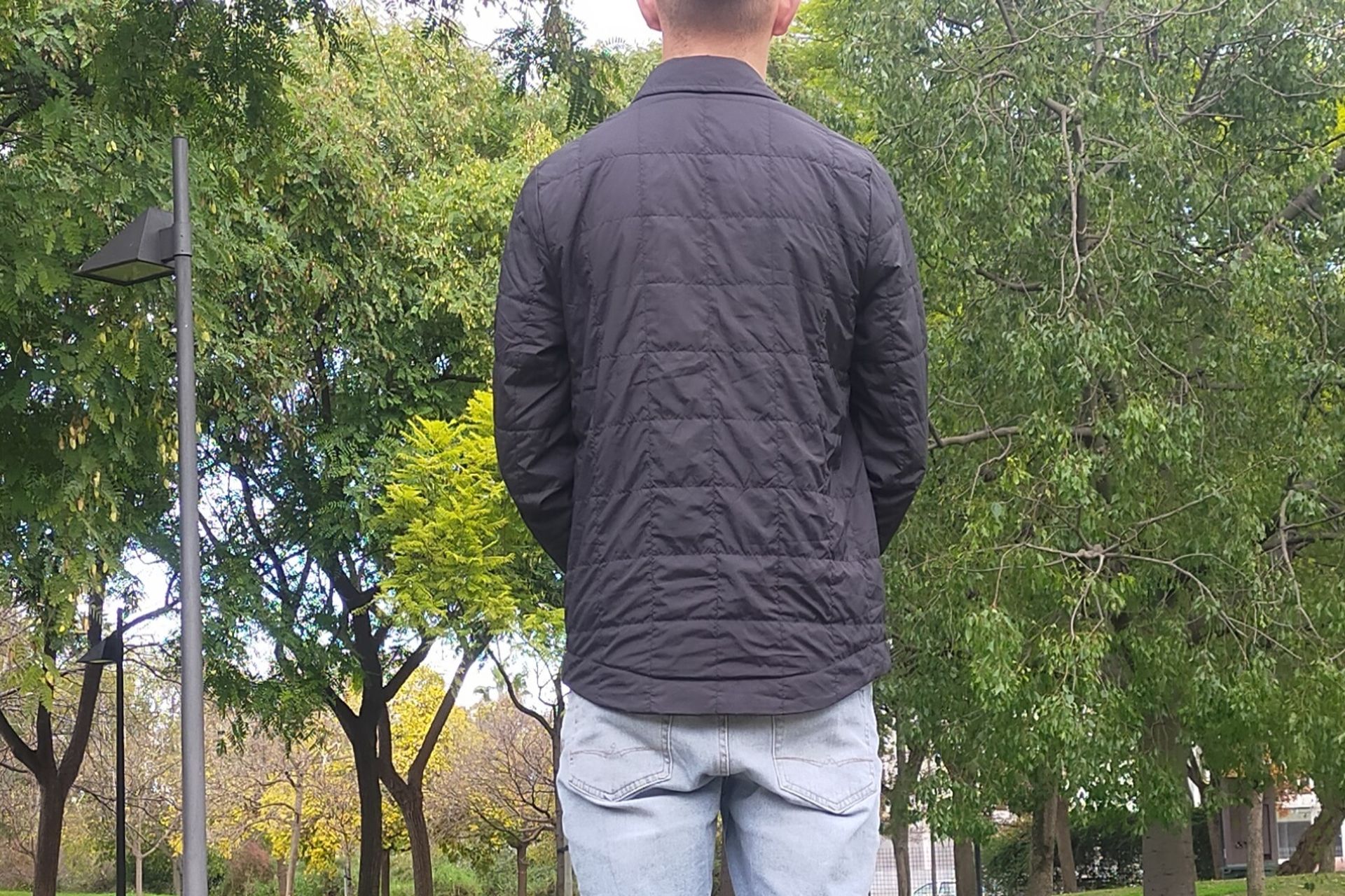 Image shows a rider wearing the Chrome Two Way Insulated Shacket