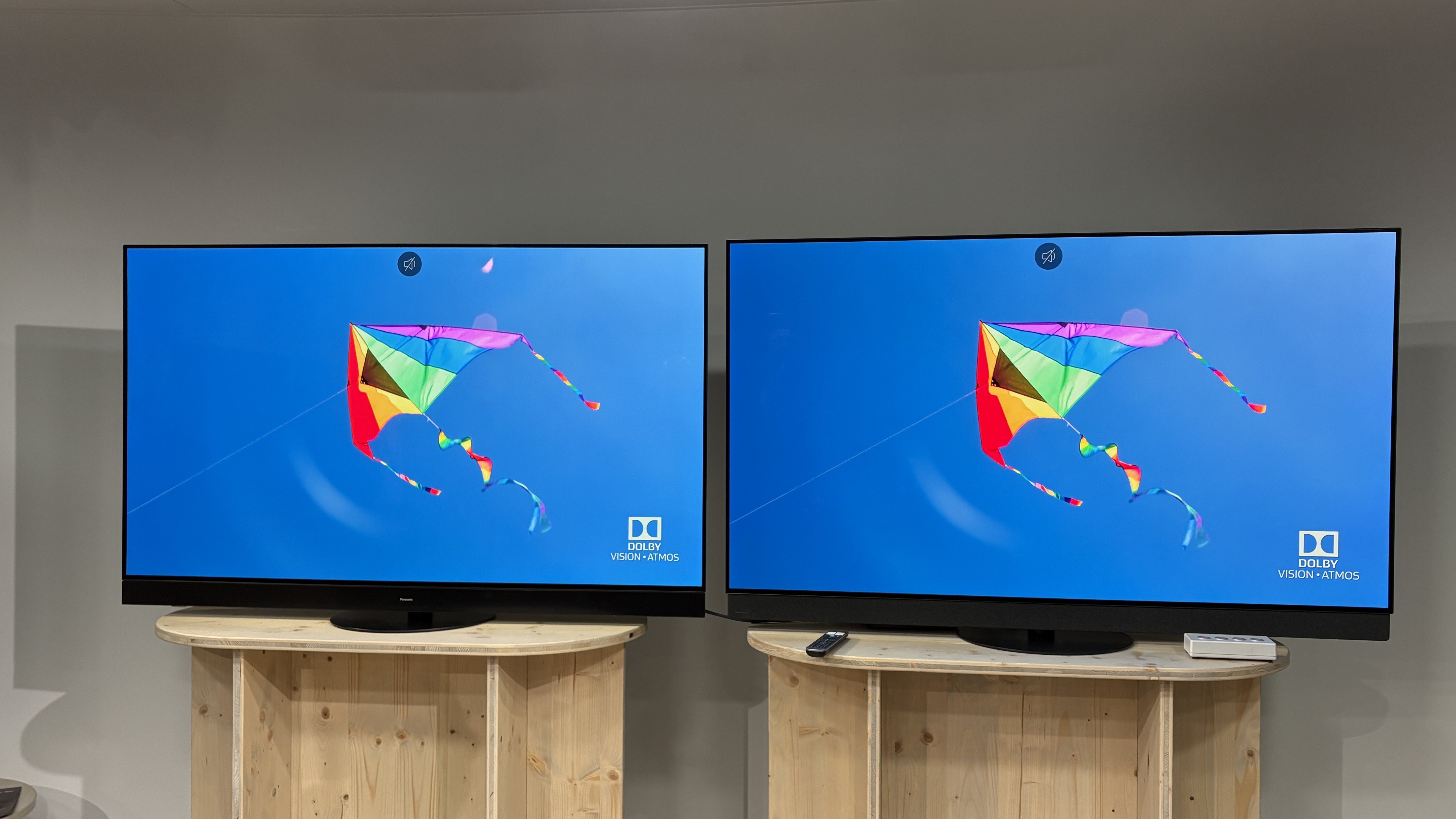 Panasonic Z95A next to a Panasonic Z95B OLED TV with a colourful kite on screen