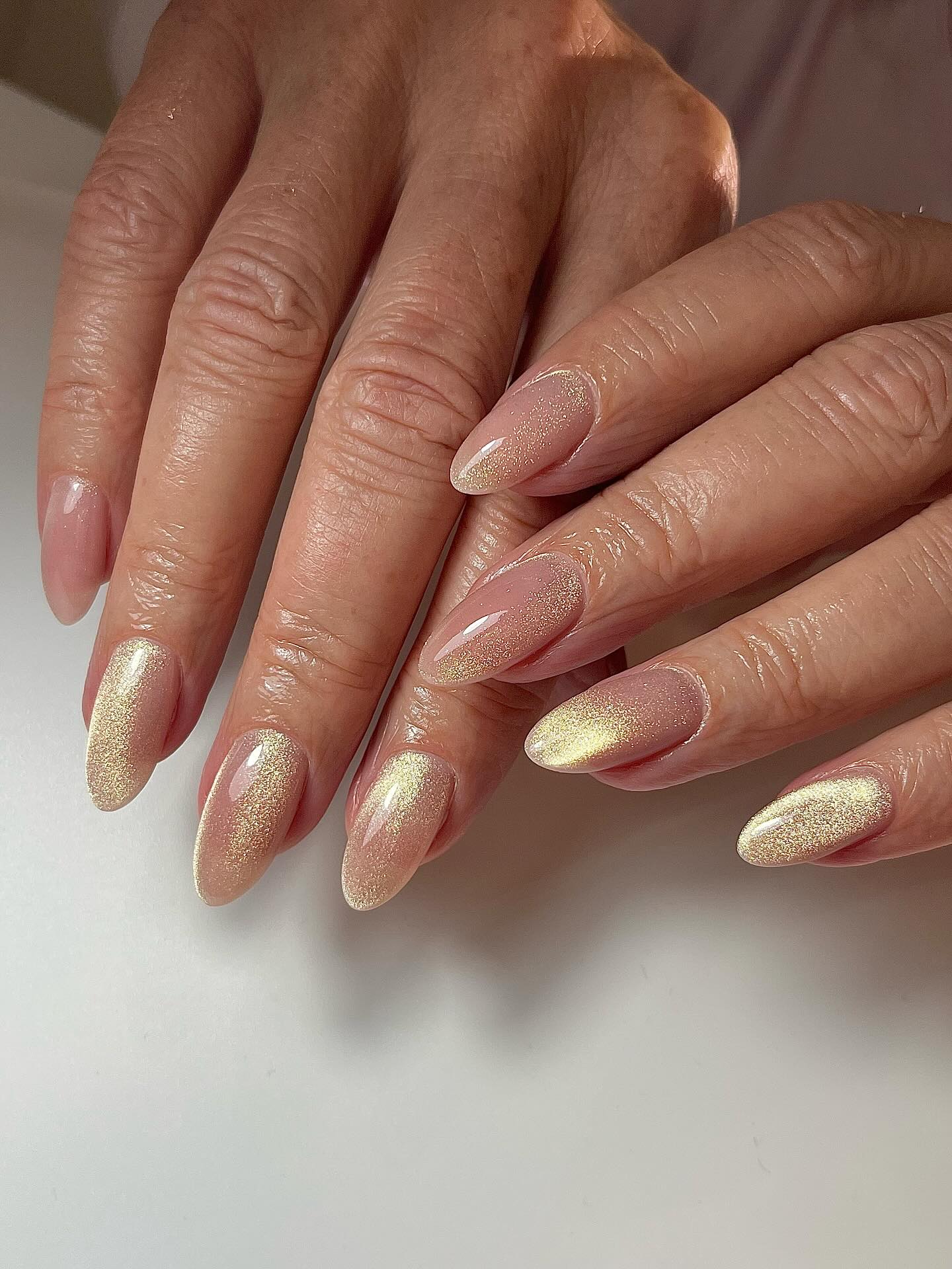 a close-up shot of baby pink velvet nails