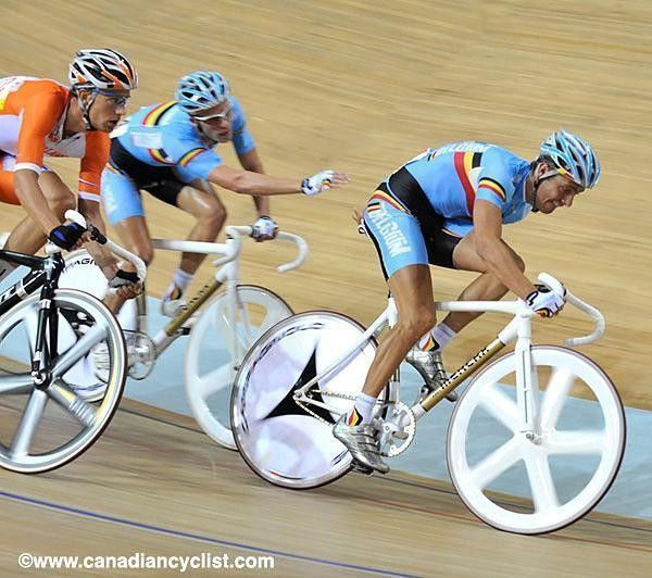 Belgium's Iljo Keisse and Kenny De Ketele desperately reach for one another during the men's madison.