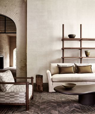 natural living room scheme with white linen sofa and shelving from Mark Alexander