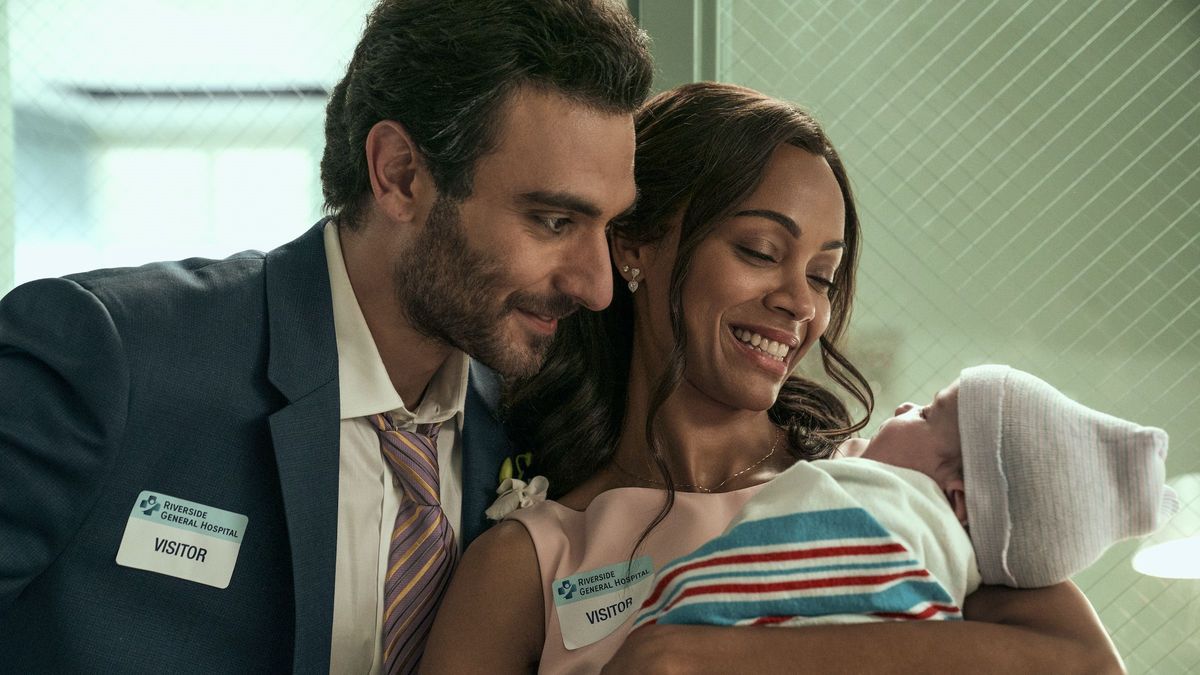 Eugenio Mastrandrea and Zoe Saldana as Lino and Amy holding their baby in From Scratch