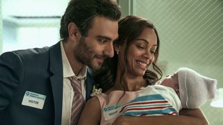 Eugenio Mastrandrea and Zoe Saldana as Lino and Amy holding their baby in From Scratch