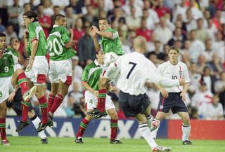 David Beckham scores a free-kick against Mexico in a 4-0 win for England in 2001.