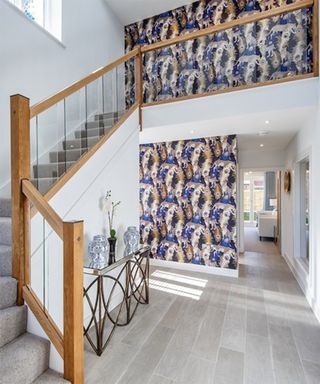 Richard Burbidge’s Immix staircase railing idea with blue peacock printed wallpaper design