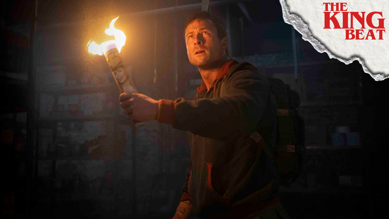Glen Powell as Ben Richards holding a torch in The Running Man The King Beat
