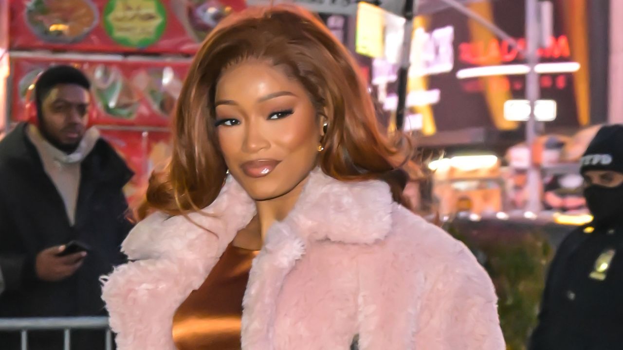 Keke Palmer attending a press tour in a fur coat and lady bag